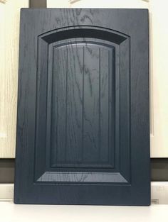 a close up of a black cabinet door