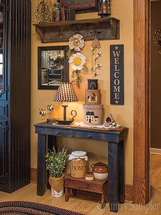 an entryway is decorated with vintage items and flowers on the wall, along with other decor