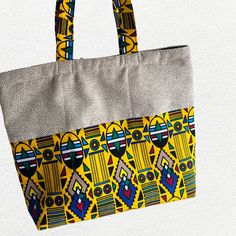 This cute colorful Tote bag will add style to any clothing and get ready for compliments.  It's handmade from a combination of plain color and bright multicolored  Cotton African  fabric which makes it unique and it will stand out. The bag measures approximately width 17 inches height 14 inches. The inside is lined and the Tote has a zipper to close.The bag has room to hold anything you may need. Casual Multicolor Fabric Canvas Bag, Multicolor Large Capacity Pouch Beach Bag, Multicolor Box Bag With Removable Pouch As Gift, Multicolor Everyday Pouch Beach Bag, Colorful Cotton Bags For Everyday Use, Casual Multicolor Canvas Bag With Removable Pouch, Multicolor Zipper Pouch Bag For Daily Use, Multicolor Pouch Box Bag For Daily Use, Multicolor Everyday Beach Bag Pouch