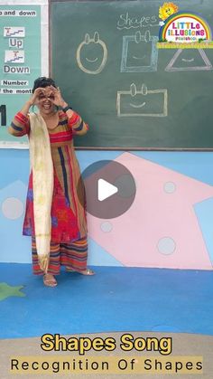 a woman standing in front of a chalkboard holding a scarf over her face with the caption shapes song recognition of shapes