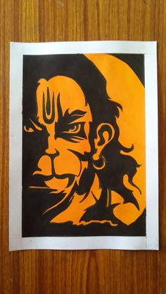 an orange and black drawing of a man's face