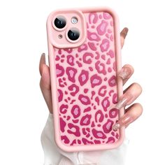 a woman's hand holding an iphone case with pink leopard print