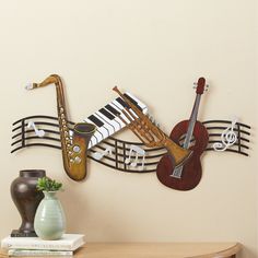 there is a wall decoration with musical instruments on it