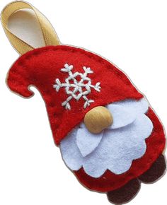 a red and white santa claus hat with snowflakes on it's head