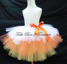 an orange and white tutule skirt on a mannequin