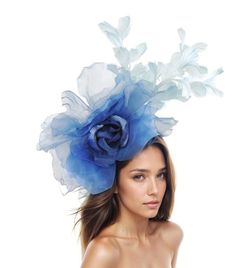 Hats By Cressida Ascot Fascinators, Wedding Hats & Kentucky Derby Hats Royal Baby Blue Hayley Feather and Silk Fascinator A mass of blue feathers surround a large silk royal and baby blue rose flower Flower is about 10 inches wide, feathers about 8-10 inches We can do this in many colours Mounted with a matching headband. If you prefer a headband to match your hair, please make a note at check out what colour headband you want. The Hayley Fascinator Hat is perfect for any special occasion, whether it's a glamorous horse race like the Kentucky Derby or a formal affair like Royal Ascot. This stunning hat features a large silk rose flower, surrounded by a gorgeous mass of feathers, making it a truly elegant headpiece. It's perfect for the mother of the bride or any woman in need of a formal h Adjustable Blue Fascinator For Summer, Blue Adjustable Fascinator For Summer, Blue Summer Fascinator Hat, Blue Mini Hat Headband For Spring, Light Blue Summer Hats For Races, Light Blue Summer Hat For Races, Light Blue Headpieces For Spring Wedding, Blue Fascinator For Royal Ascot Garden Party, Blue Fascinator For Garden Party At Royal Ascot