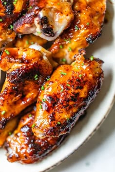 grilled chicken wings on a white plate