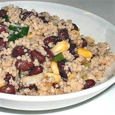 a white bowl filled with rice and beans