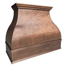 an old fashioned copper colored stove hood on a white background