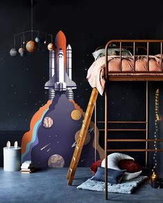 a child's bedroom with space themed wallpaper and bunk beds, including a rocket ship