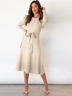 Indulge in luxury with our Robin Tie Waist Sweater Midi Dress in chic apricot. The tie waist accentuates your figure while the midi length adds a touch of sophistication. Made from a soft and comfortable knit, this dress is perfect for all-day wear. Elevate your style with this exclusive piece. Size Guide: Model is 5’8” tall, and has a 33.5” bust, 26.4” waist, & 35.6” hips. She is wearing a S / US 4 / AU 8. This sweater dress is true to size. Material: 100% Cotton. Feature: Crew neckline. Ruched shoulder. Long sleeves. Ribbed Soft knit fabric. Tie Waist. Midi length. Relaxed fit. Care Instructions: Machine wash / Cold hand wash Midi Dress Outfit, Retro Mode, Puff Long Sleeves, Sweater Dress Midi, Long Sleeve Midi, Mid Length Dresses, Fashion Colours, Perm, Black Midi Dress