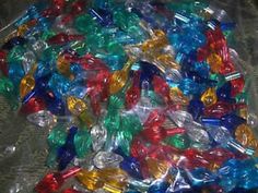 many different colored lights in plastic bags on a table