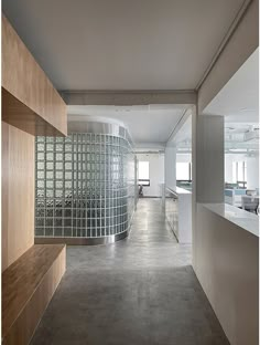 an empty room with lots of glass blocks on the wall and shelves in front of it