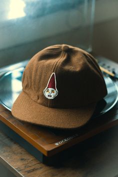 CLOTH MONSTERS: VOLUME 1 El Duende (The Drawf/Gnome) on wool info: 6 panel Brown wool cap with adjustable strap Brown Wool Six-panel Hat, Vintage 5-panel Winter Hat, Vintage Winter 5-panel Hat, Winter Brown Flat Bill Baseball Cap, Wool Six-panel Winter Hat, Winter 5-panel Baseball Cap For Streetwear, Winter Wool Six-panel Hat, Brown 5-panel Winter Hat, Winter Baseball Cap With Flat Brim, One Size