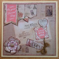 a close up of a greeting card on a wooden surface with many different things in it