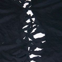 the black fabric has been cut in half