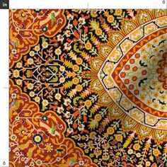 an orange, yellow and black rug with floral designs on the center is featured in this image