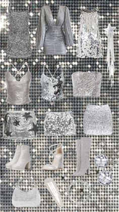 several different types of clothes and shoes on display in a window sill with silver sequins