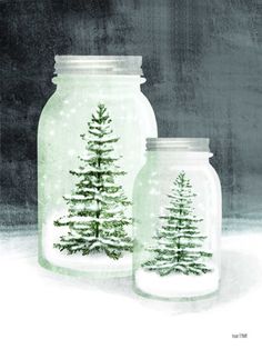 two glass jars with christmas trees in them