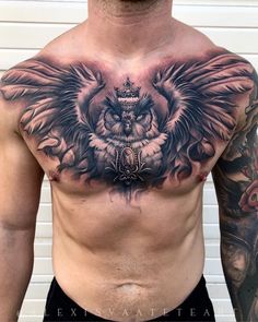 a man with tattoos on his chest has an owl and crown tattoo on his chest