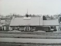 an old black and white photo of a building