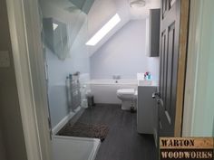 the bathroom is clean and ready to be used as a home office or guest room