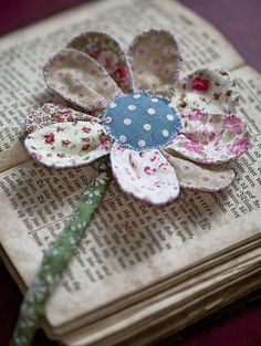 a book with a flower on top of it