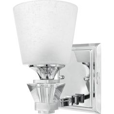 a wall mounted light fixture with a white glass shade on the front and back of it