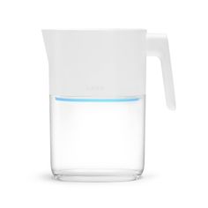 a glass pitcher with water in it on a white background