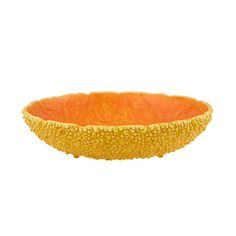 an orange bowl on a white background