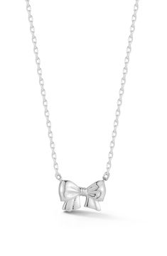 A dainty bow pendant necklace crafted from sterling silver or 14-karat gold vermeil brings sweet shine to any look. 18" length; 1/4"W x 3/8"L Sterling silver/rhodium plate or 14k-gold plate Made in Turkey Cole Haan Women Shoes, Xoxo Jewelry, Silver Jewelry Necklaces, Dr Wardrobe, Outfit Pieces, Silver Jewlery, Dainty Jewellery, Bow Pendant, Bow Necklace