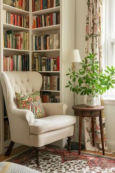 a chair and table in front of a bookcase with books on the shelves behind it