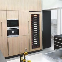 a wine rack in the middle of a kitchen