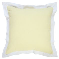 a yellow and white pillow on a white background