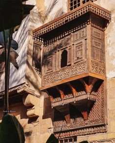 an old building with carved wooden balconies