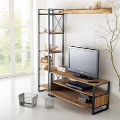 an entertainment center with a television, bookshelf and baskets