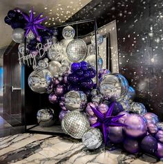 purple and silver decorations in front of a door