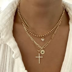 Angelic cross necklace with cubic zirconia detail. Perfect to wear alone or to layer with other necklaces 14k Gold Filled Chain 14k Gold Filled Charm Chain length: 16", 18", 20" Lobster clasp closure Hypoallergenic Water resistant & tarnish free Nickel & lead free Necklace Layering Ideas, Necklace Stacks, Classic Pendant Necklace, Necklace Stack, Stacked Necklaces, Multi Layer Necklace, Jewelry Accessories Ideas, Estilo Punk, Stacked Jewelry