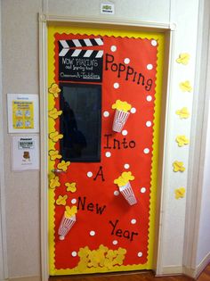 a door decorated to look like popcorn with the words popping into a new year written on it