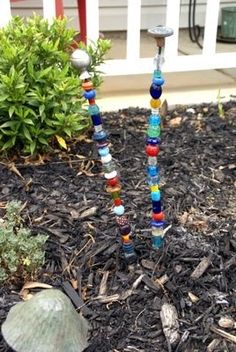 there are many beads in the garden and one is made to look like a tree