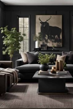 a living room with black walls and furniture