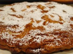 a pastry with powdered sugar sitting on top of it