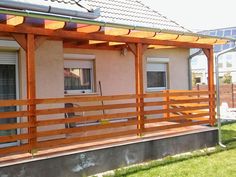 a house with a wooden deck in front of it