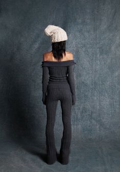 These flare pants have a stretchy cable knit construction, a flare leg silhouette, and a fold-over waistband. Sweater Flare Pants, Winter Flare Pants With Stretch, Stretch Flare Pants For Winter, Winter Stretch Flare Pants, Fitted Knit Bottoms For Fall, Fuzzy Pants, Fitted Knit Bottoms For Winter, Fitted Cable Knit Casual Bottoms, Fitted Knit Pants For Loungewear