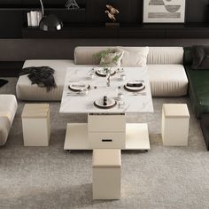 a living room filled with furniture and a white table