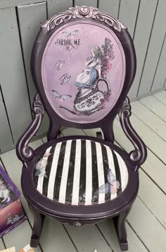 a purple chair sitting on top of a wooden floor