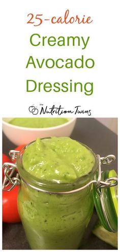 a jar filled with green creamy avocado dressing