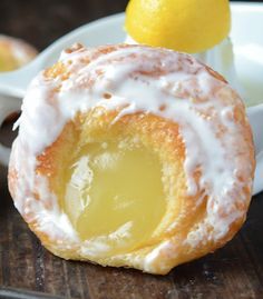 a close up of a doughnut with icing on a plate