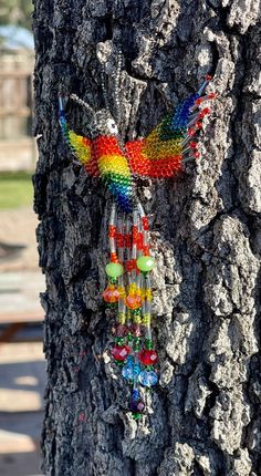 a tree with beads hanging from it's bark