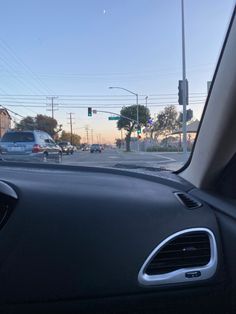 the dashboard of a car at an intersection